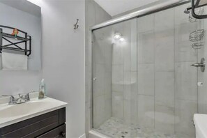 Shower, hair dryer, towels, soap