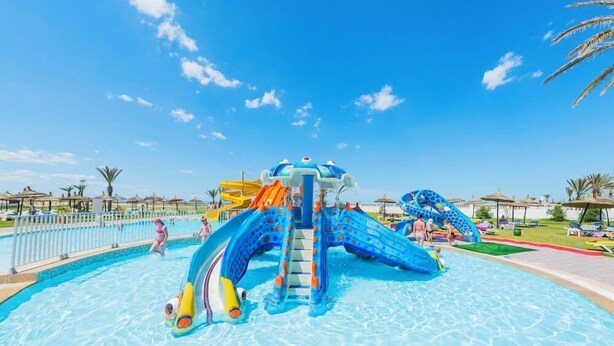 A water park with slides and a pool.