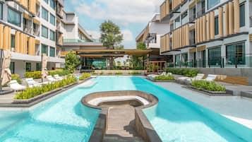 Outdoor pool, open 7:00 AM to 7:00 PM, pool umbrellas, pool loungers