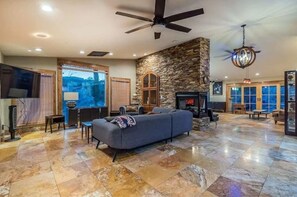 Smart TV, fireplace, books, printers