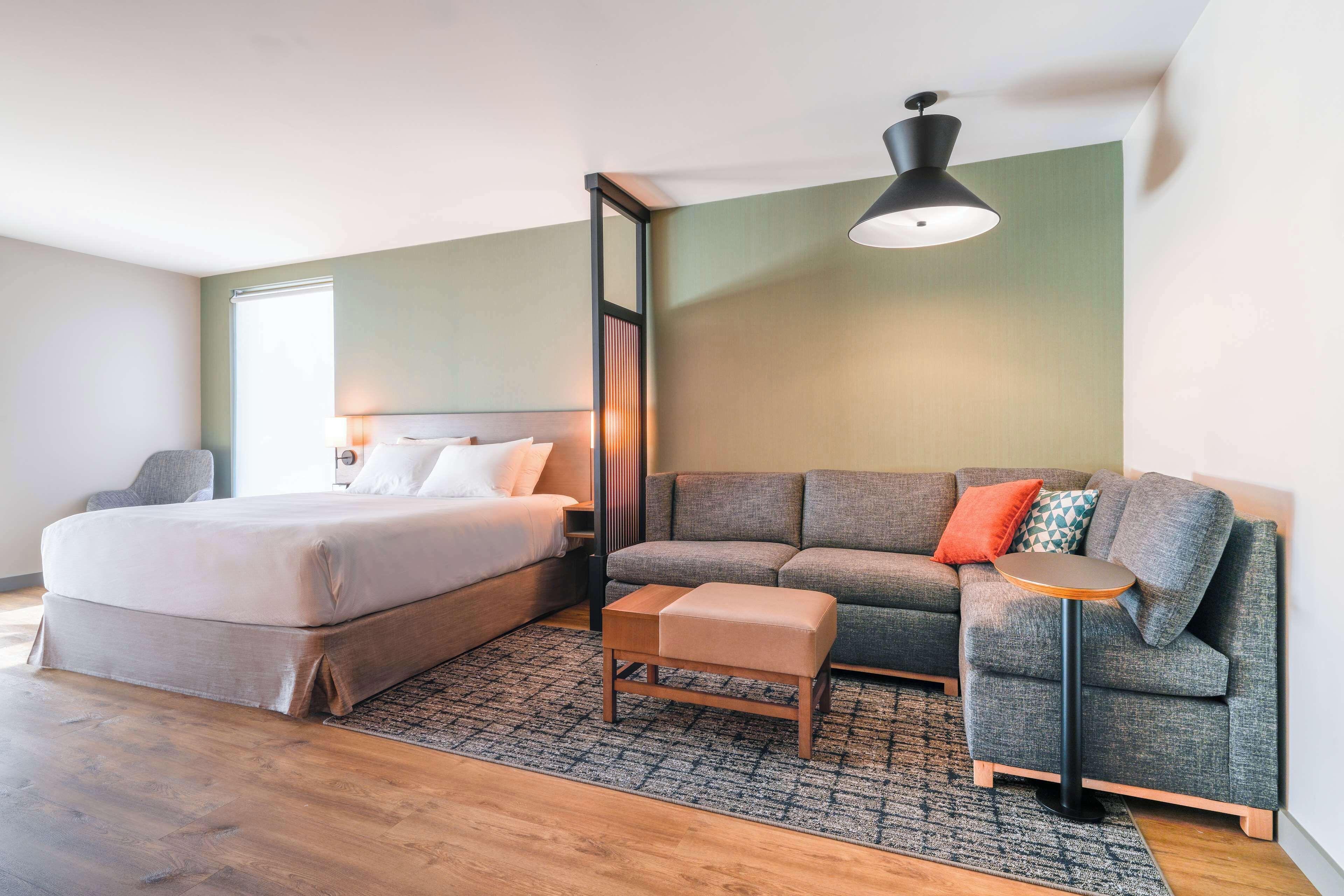 room, 1 king bed with sofa bed, accessible (roll-in shower) | premium bedding, in-room safe, blackout curtains, iron/ironing board