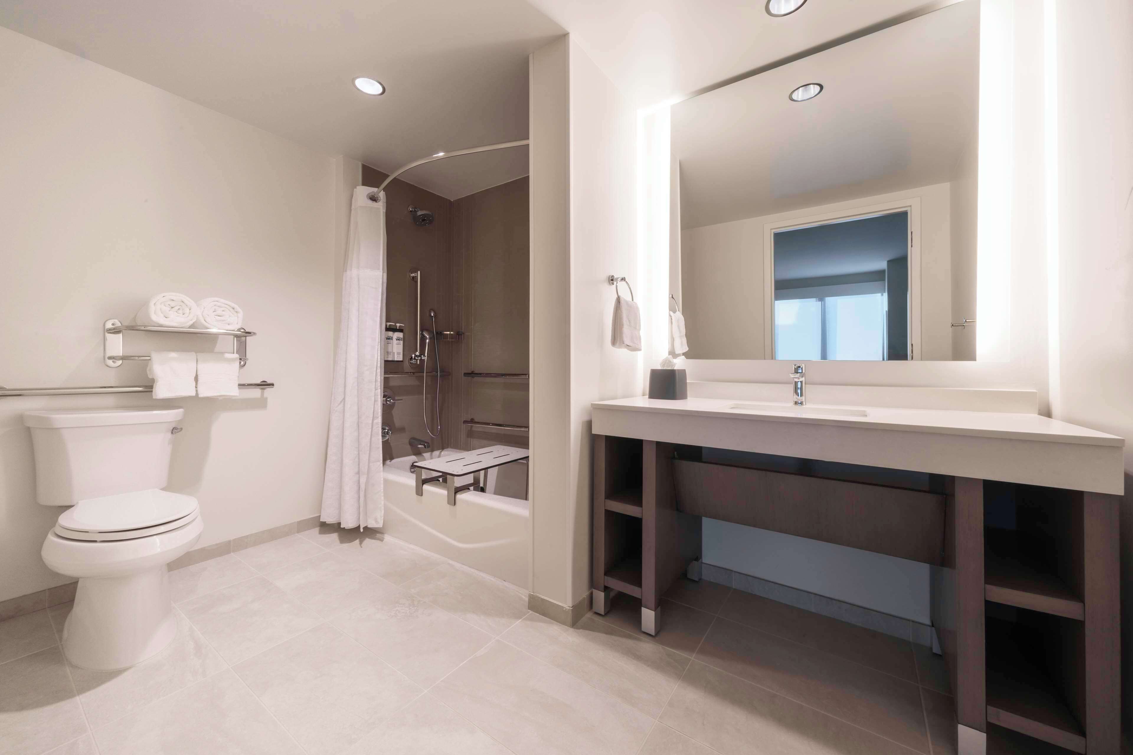 rainfall showerhead, hair dryer, towels, soap