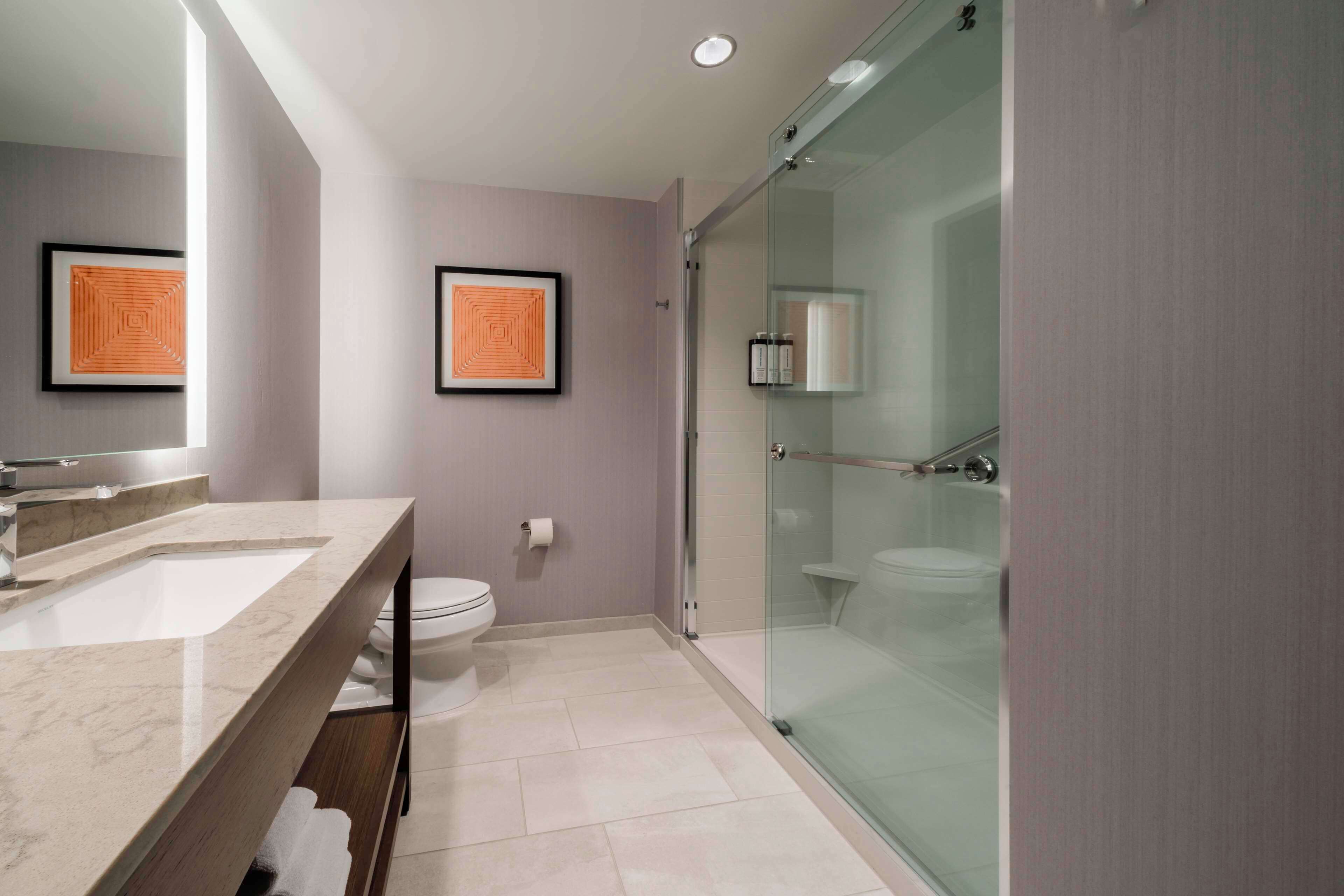 rainfall showerhead, hair dryer, towels, soap