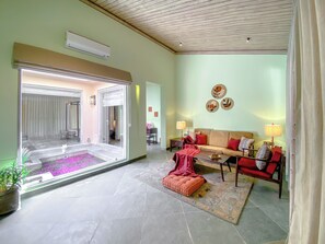 Luxury Villa (Heated Plunge Pool) | Living area | 55-inch LED TV with cable channels, TV - Brij Bageecha Jaipur - Private Villas with Heated Plunge Pool (Jamwa Ramgarh)