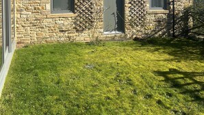 A stone house with a sloped roof, two windows, and a door. - Gardener's Cottage with Stunning Views (Rowlands Gill)