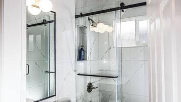 Shower, hair dryer, towels, soap