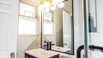 Shower, hair dryer, towels, soap