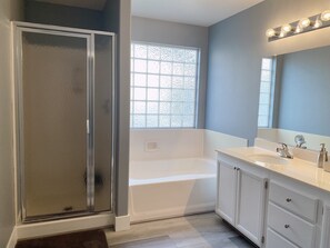 Shower, hair dryer, towels, shampoo