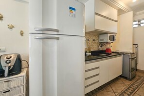 Apartment | Private kitchen | Full-size fridge, microwave, cookware/dishes/utensils