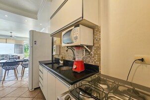 Apartment | Private kitchen | Full-size fridge, microwave, cookware/dishes/utensils