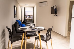 Standard Apartment | Living area | Flat-screen TV