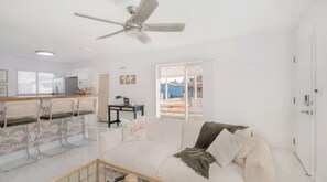 Relax in this inviting living space with a sofa, table, and chair.