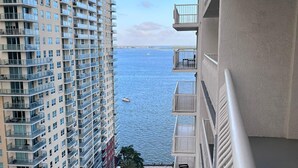 A high-rise building with multiple balconies overlooking a body of water. - Modern with Breathtaking Views (Miami)