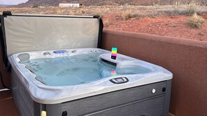 A hot tub with a control panel, a step stool, and a view of a desert landscape with mountains. - "Solitude De La Sal", Private Hot Tub, Pools, Views, Sleeps 8 (Moab)