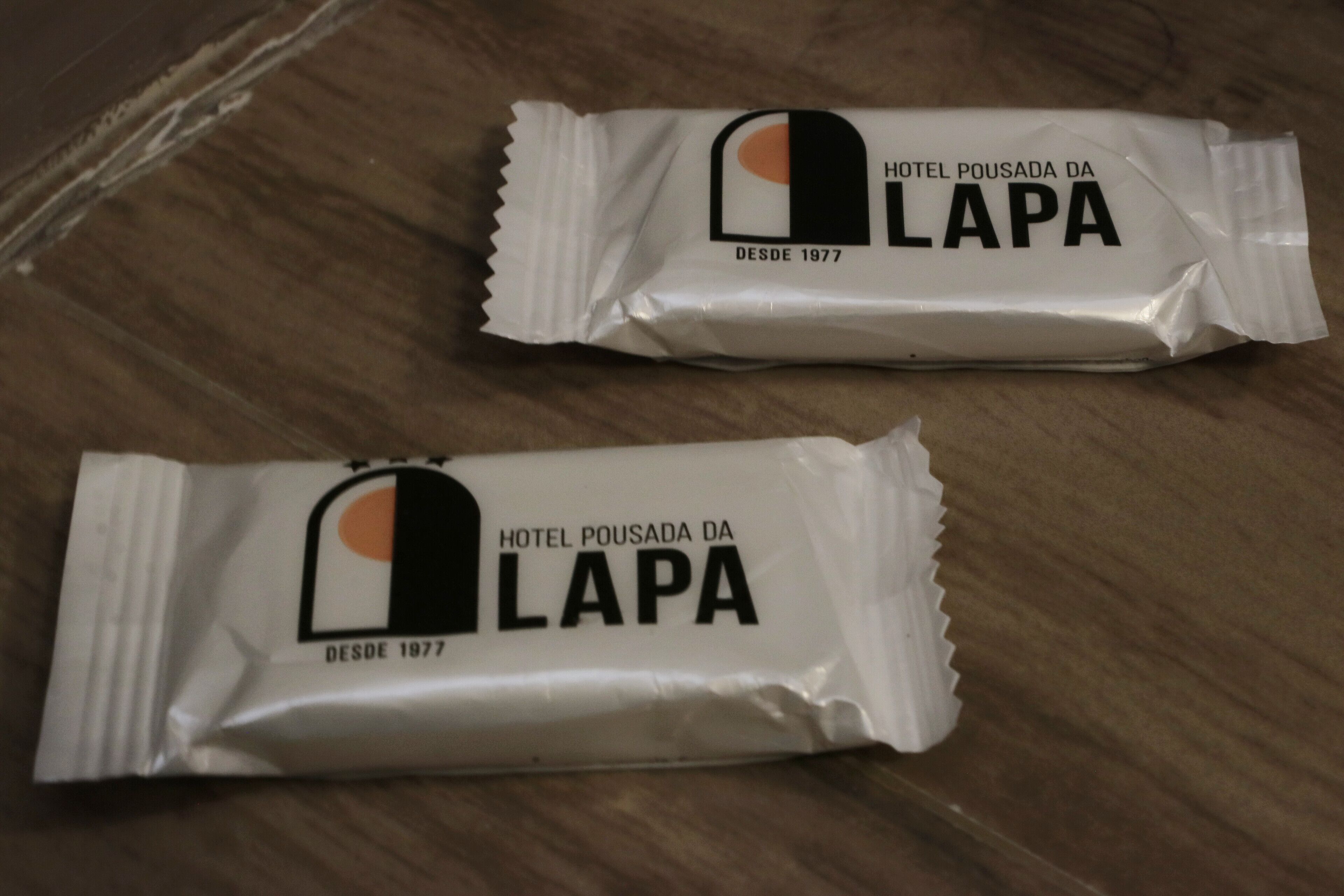 Two packages of Hotel Pousada da Lapa branded snacks.