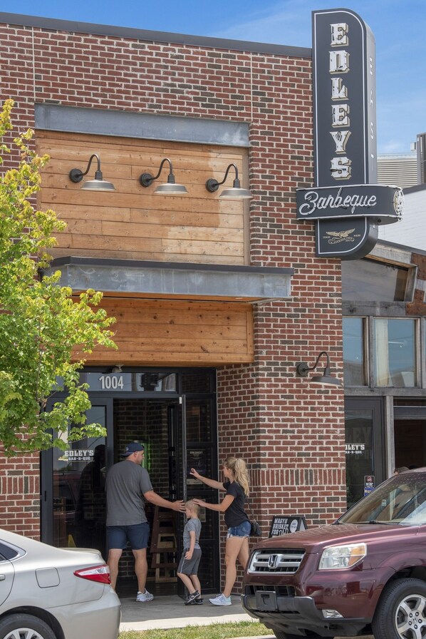 A brick building with a sign reading 'EILEY'S Barbeque' and a number '1004' on the door.