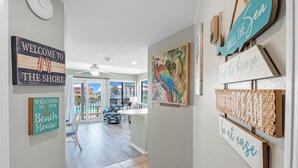A hallway with signs reading "Welcome to the Shore," "Be at ease," and "Smell the Sea." - Gulf Shores Plantation-West 1240 (Gulf Shores)