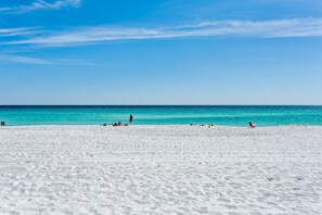 A beach with white sand and clear turquoise water. - Gulf Front Large 3/3 Condo!  Steps to the Beach!  Community Pool! (Pensacola Beach)