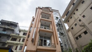 A multi-story building with balconies and a central open space. - OYO 161 Ram Janaki Hotel (Kathmandu)