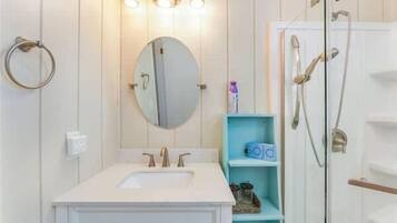 Shower, hair dryer, towels, shampoo