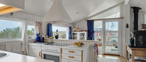 Fridge, stovetop, dishwasher, coffee/tea maker