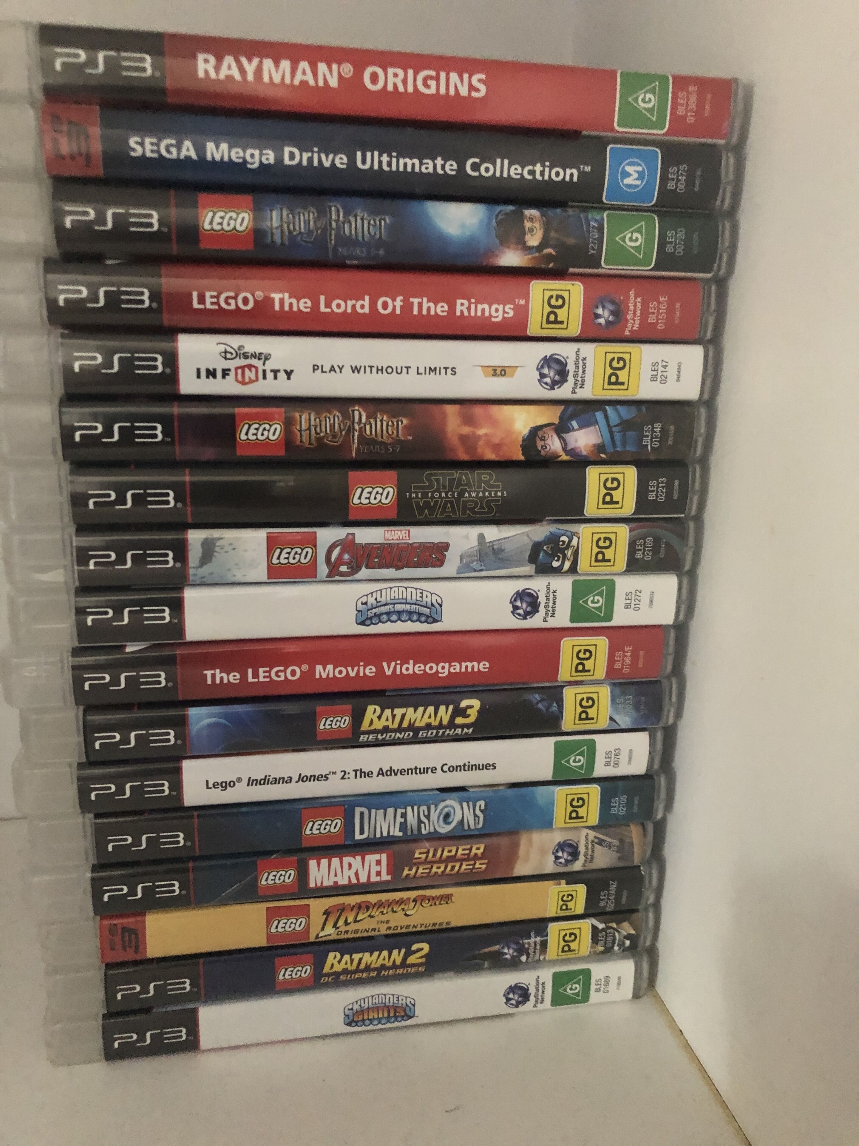 A collection of PS3 video games, including titles like LEGO Harry Potter and LEGO Star Wars, arranged vertically.