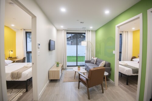 A Gem in the Heart of Queens: 2 Bed + 2 Bath with Large Backyard