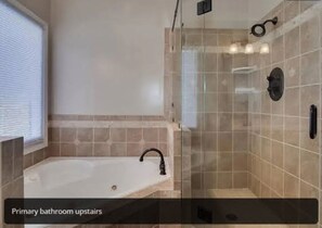 Shower, jetted tub, towels, soap