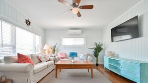 A living room with a wooden coffee table, white sofas, and a teal cabinet. - "Island Time!" Steps 2 Beach & Downtown AC+Dogs OK (Brigantine)