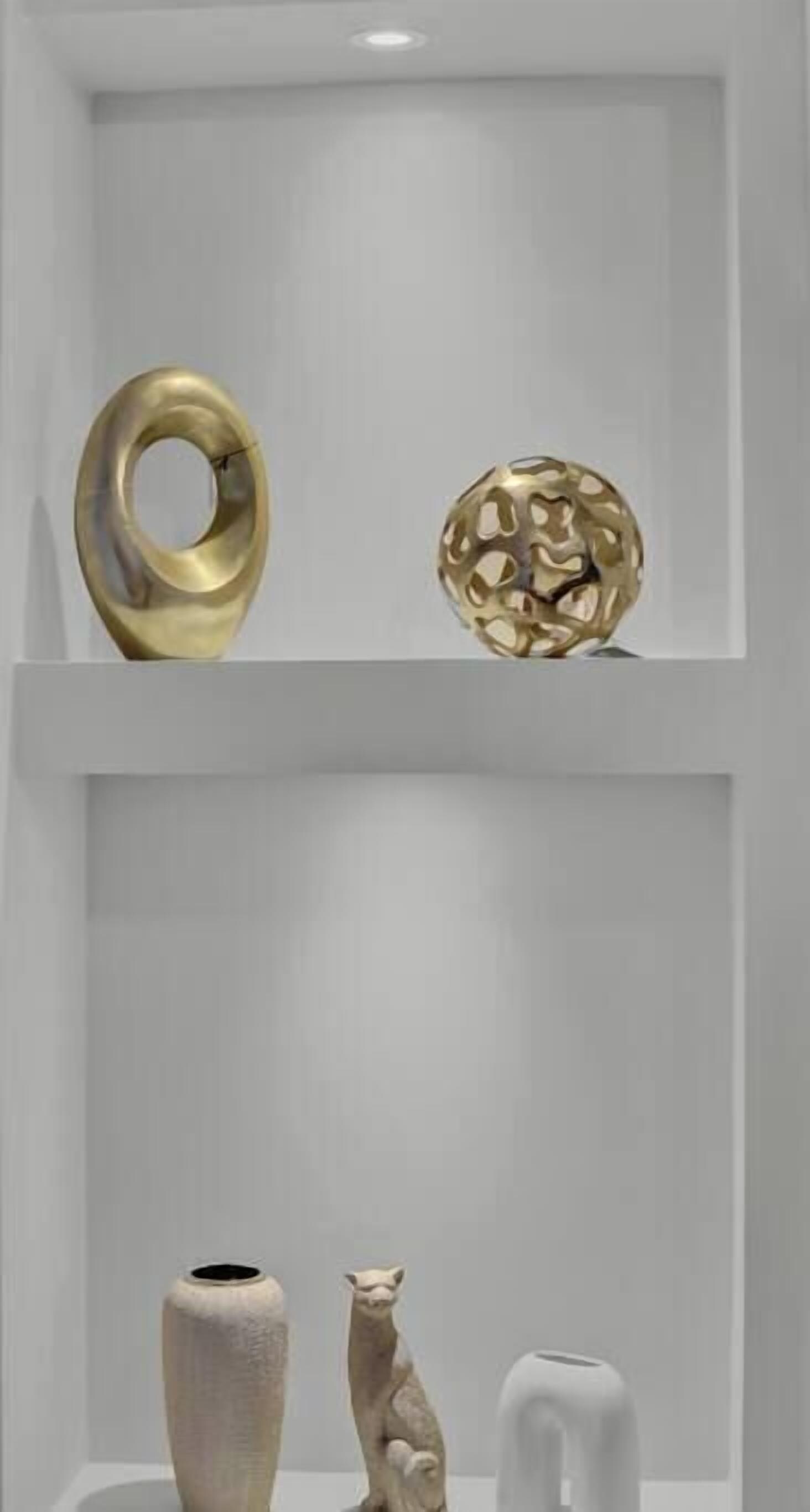 A modern interior with two shelves displaying various decorative items.