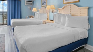 A hotel room with two beds, a view of the sea, a balcony, and a large window. - Sea Mist 20909 (Myrtle Beach)
