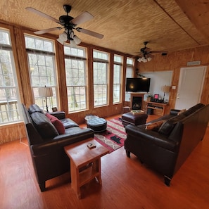 Relax in this stylish living room with two comfortable sofas, a coffee table, and a flat-screen TV.