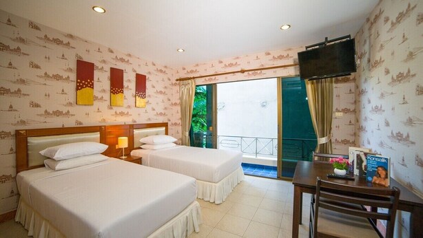 A hotel room with two beds, a TV, a balcony with a view, and a dining area. - Kamala Cool 2 (Kamala)