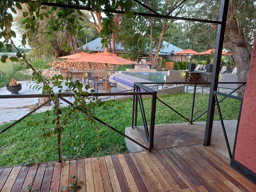 Riverside Splash- Stylish and Cozy Cottages by the River bank