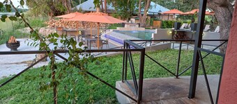 Riverside Splash- Stylish and Cozy Cottages by the River bank