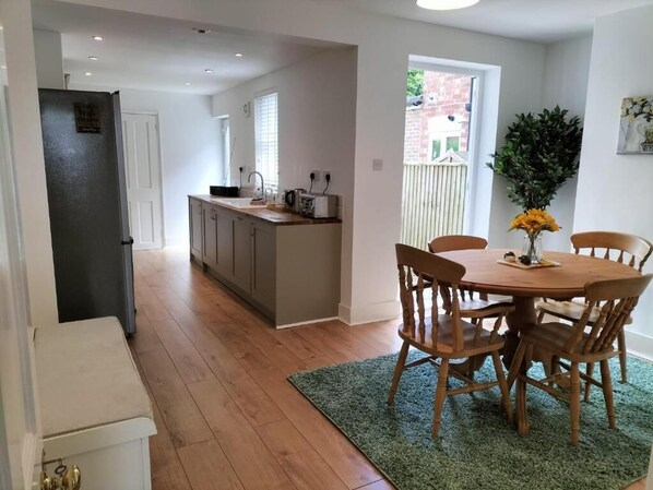 Enjoy meals in the kitchen with oven and refrigerator, and dine at the round table with four chairs.