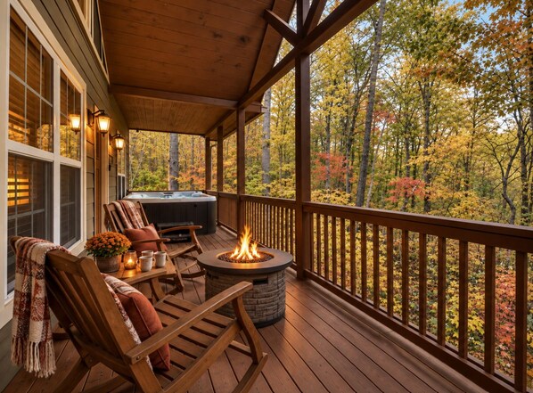 A wooden deck with a fire pit and outdoor seating.
