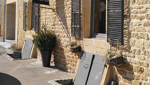 A stone building with a black banner reading "La Cambrioleuse Restaurant - Maison d'hôtes." - La Cambrousse (Villers-la-Chèvre)