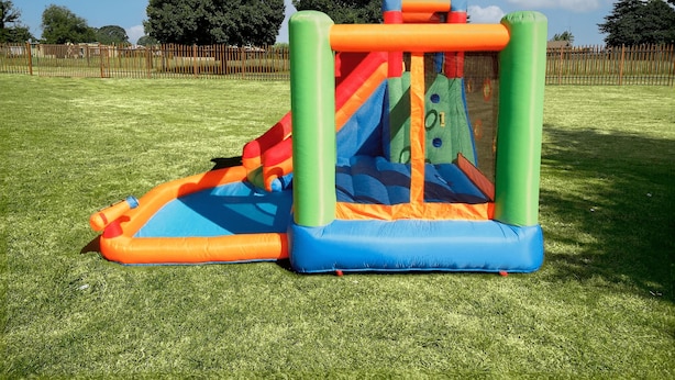 A colorful inflatable play structure in a grassy field. - Captivating 1-bed Studio in Springs (Springs)