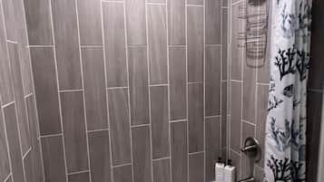 Shower, hair dryer, towels, shampoo