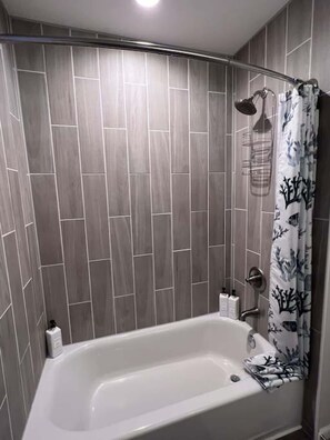 Shower, hair dryer, towels, shampoo