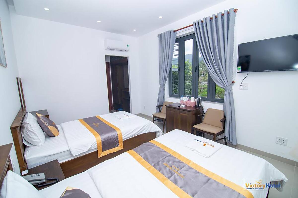 Kamar Twin Superior | Seprai antialergi, selimut bulu angsa, minibar, dan meja kerja