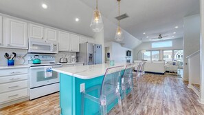 Enjoy cooking in this well-equipped kitchen with a central island and stainless steel appliances.