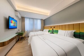 A hotel room with two beds, a desk with a chair, a flat-screen TV, and a window with curtains. - Langfeng Capital Hotel Zhongshan (Former Sun Yat-sen · Nanlang Station Branch) (Zhongshan)