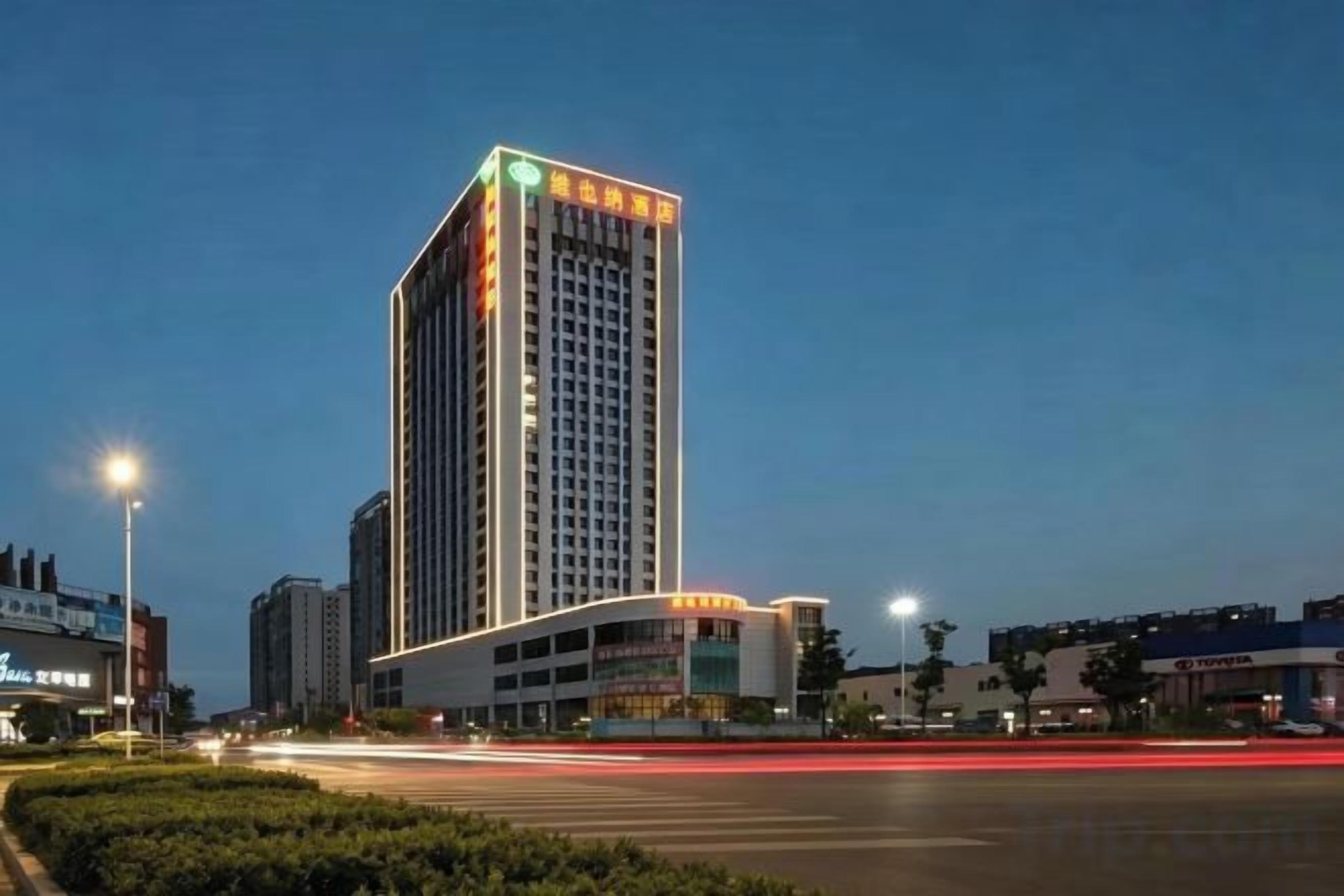 A high-rise building with a modern design, featuring a prominent entrance and a flat roof.