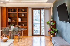 City Apartment | Living area | 50-inch Smart TV with cable channels, TV, Netflix - Acropolis Prestige Residence (Athens)