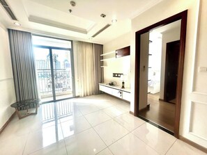 Standard Apartment | Desk, blackout drapes, soundproofing, iron/ironing board - An Corner Vinhomes Central Park (Ho Chi Minh City)