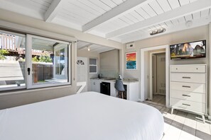 Relax in this spacious room with a large bed, desk, kitchenette, and flat-screen TV.