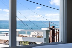 Enjoy breathtaking views of the coastline from this room's window.