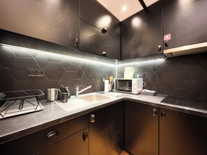 Fridge, microwave, stovetop, coffee/tea maker
